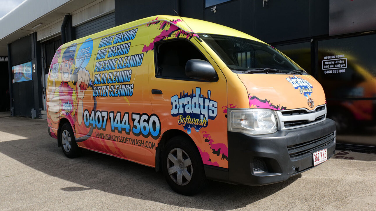 Brady's Softwash yellow-orange van wrap listing house, roof, pressure, solar & gutter cleaning