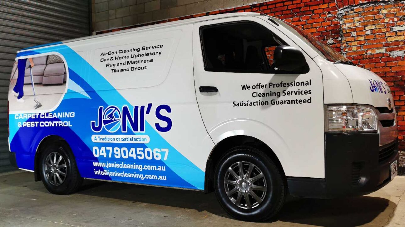 White van with Joni’s Cleaning Service blue wrap listing Air Con, upholstery and tile cleaning