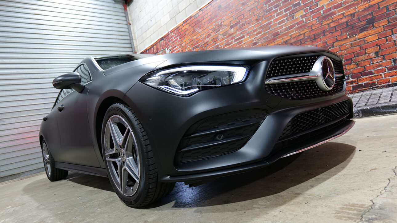 Satin matte black Mercedes A-Class AMG full vinyl wrap in Omega Graphix garage